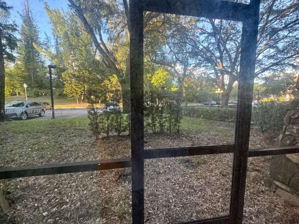 3720 Inverrary Drive, Unit 1N Lauderhill, FL 33319 - Photo 12 of 45 a view of a yard from a balcony