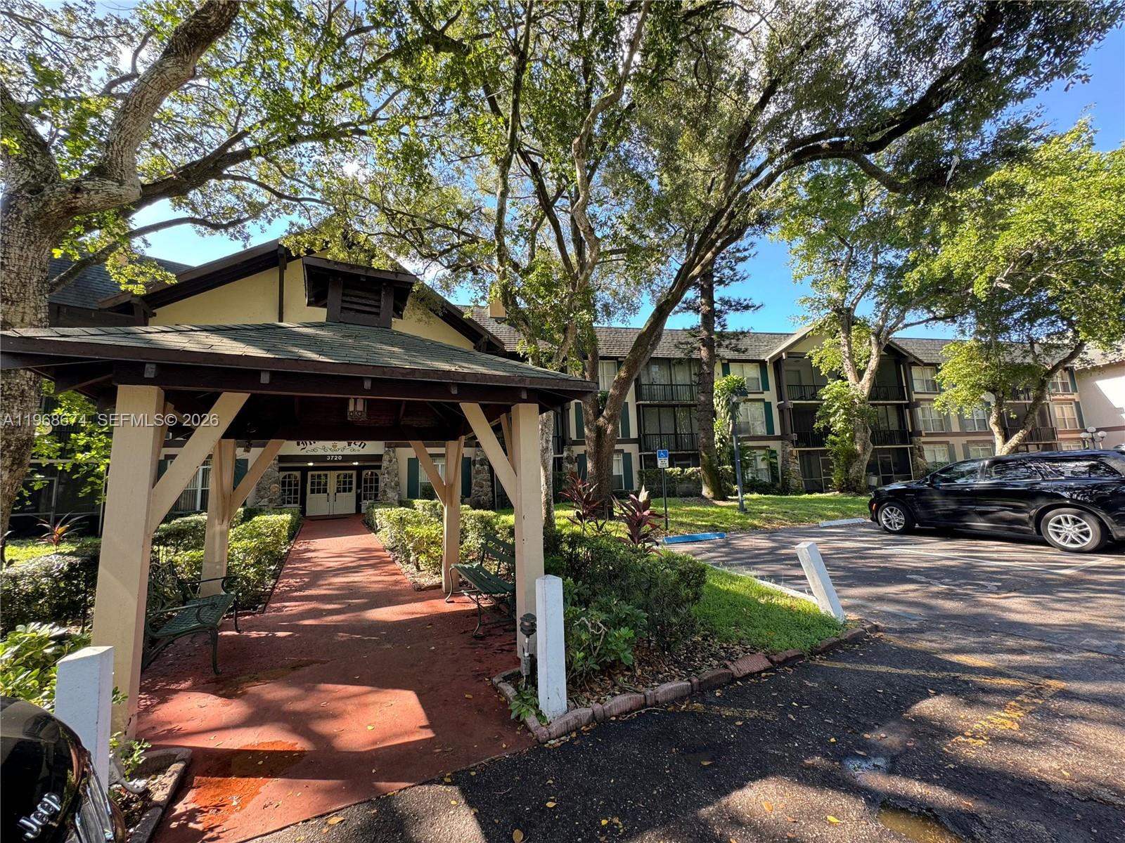 3720 Inverrary Drive, Unit 1N Lauderhill, FL 33319 - Photo 3 of 45 a view of a car park in front of house