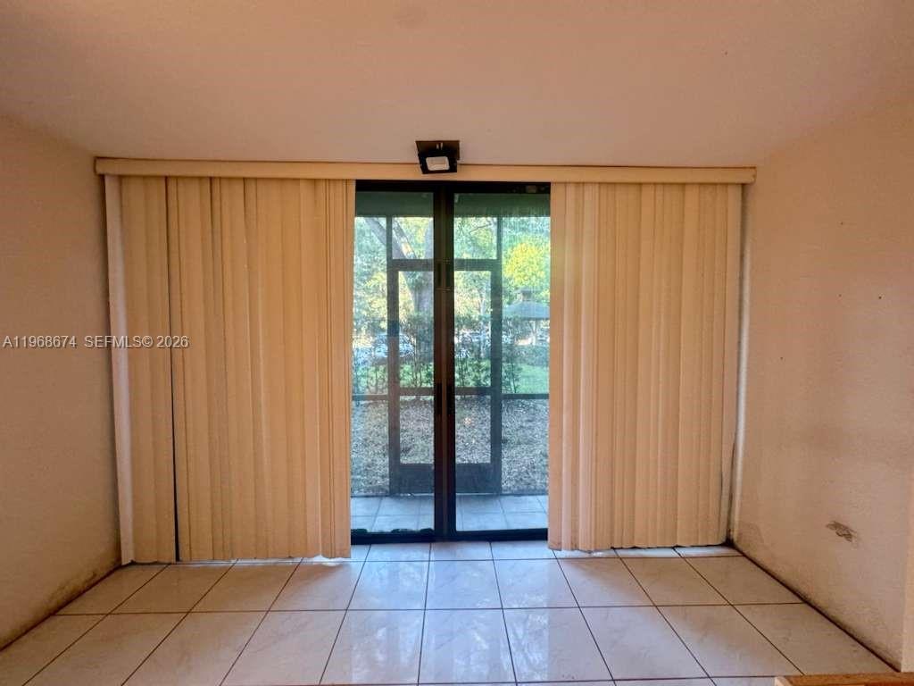 3720 Inverrary Drive, Unit 1N Lauderhill, FL 33319 - Photo 9 of 45 a view of entryway with window