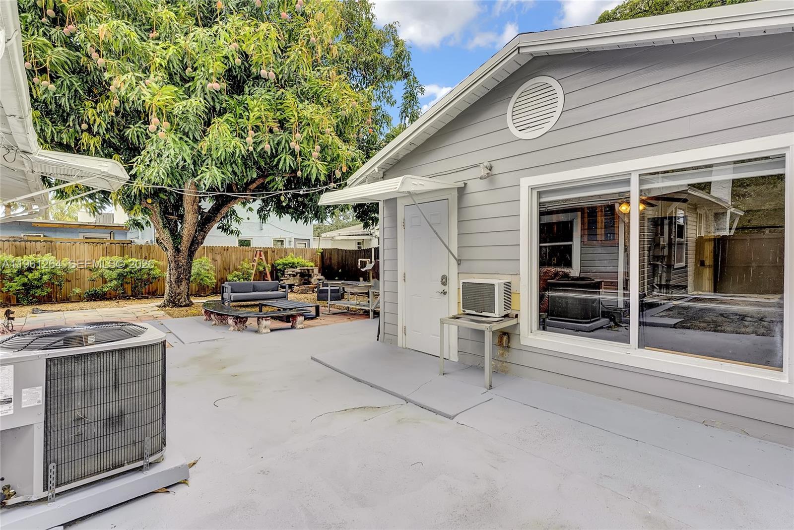 107 Stirling Road Dania Beach, FL 33004 - Photo 4 of 17 a view of a patio with table and chairs and potted plants