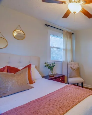 a bedroom with a bed and window