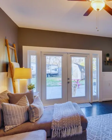 a living room with furniture and a window