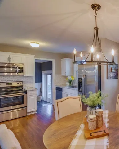 a living room with furniture or kitchen and a fireplace