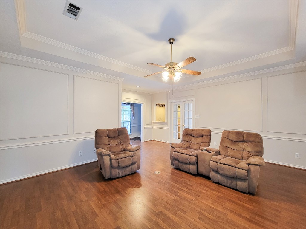 5810 Glenmere Lane Spring, TX 77379 - Photo 11 of 46 a living room with furniture and a chandelier