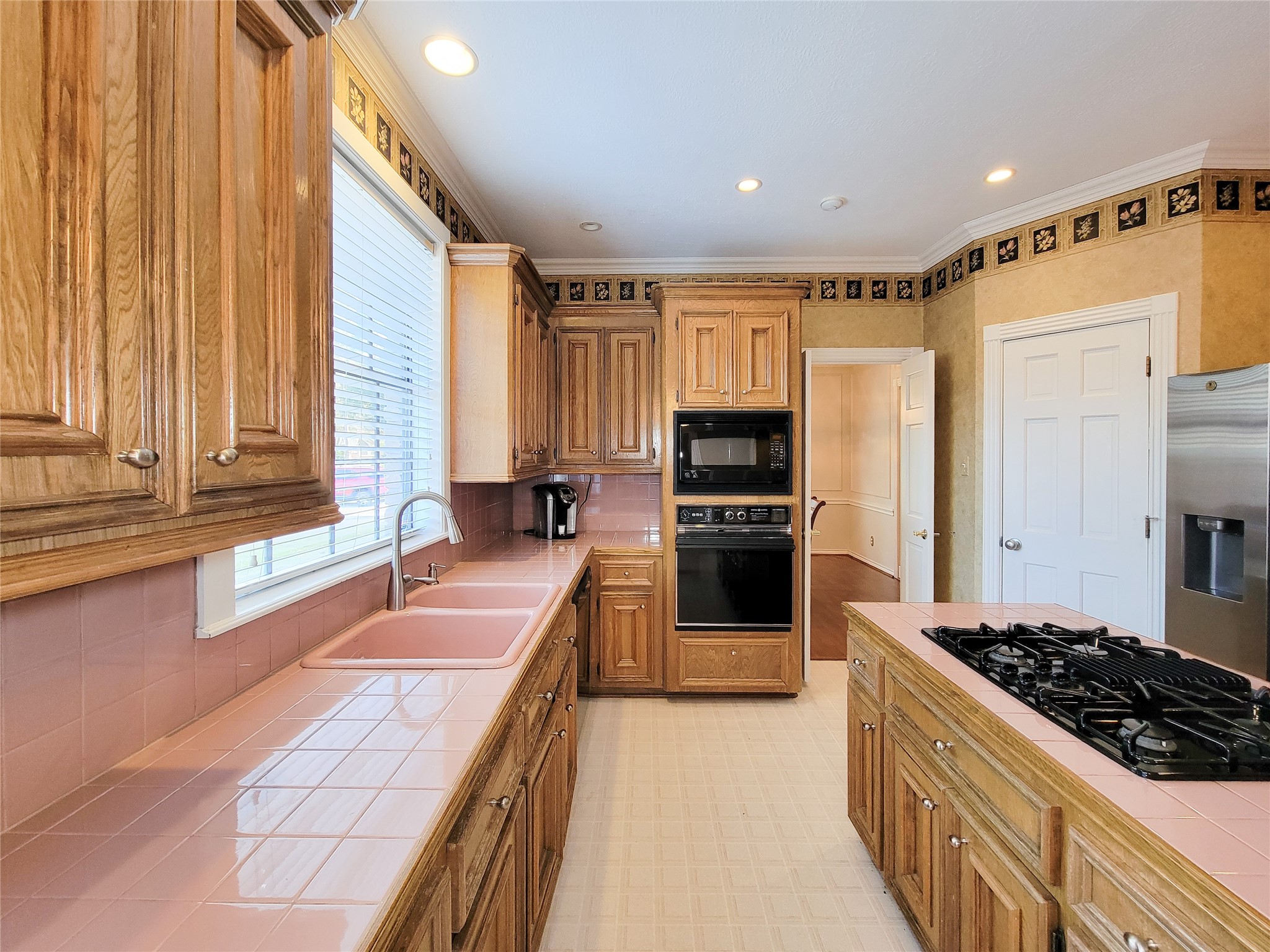 5810 Glenmere Lane Spring, TX 77379 - Photo 15 of 46 a kitchen with granite countertop a sink stove and refrigerator