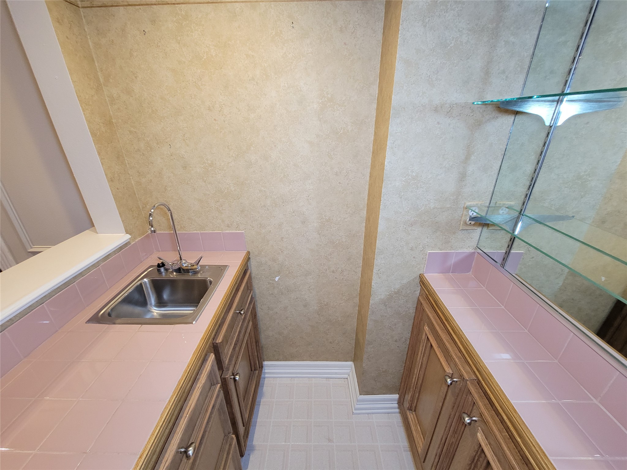 5810 Glenmere Lane Spring, TX 77379 - Photo 17 of 46 a bathroom with a sink and vanity