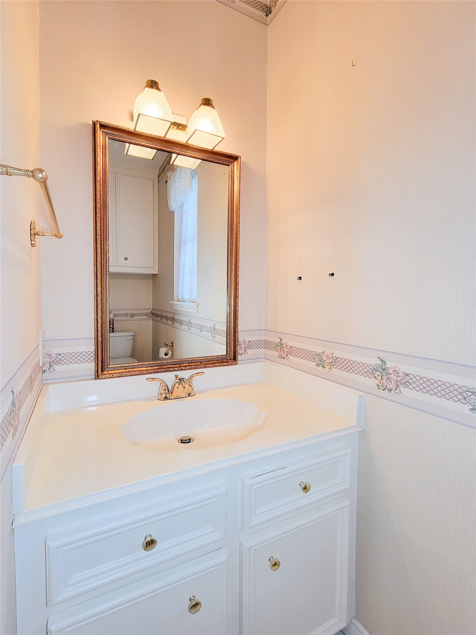 5810 Glenmere Lane Spring, TX 77379 - Photo 18 of 46 a bathroom with a sink and a mirror