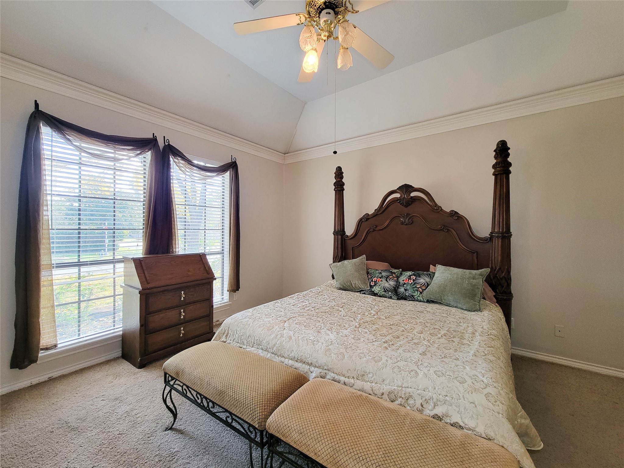 5810 Glenmere Lane Spring, TX 77379 - Photo 25 of 46 a bedroom with a bed and a chandelier