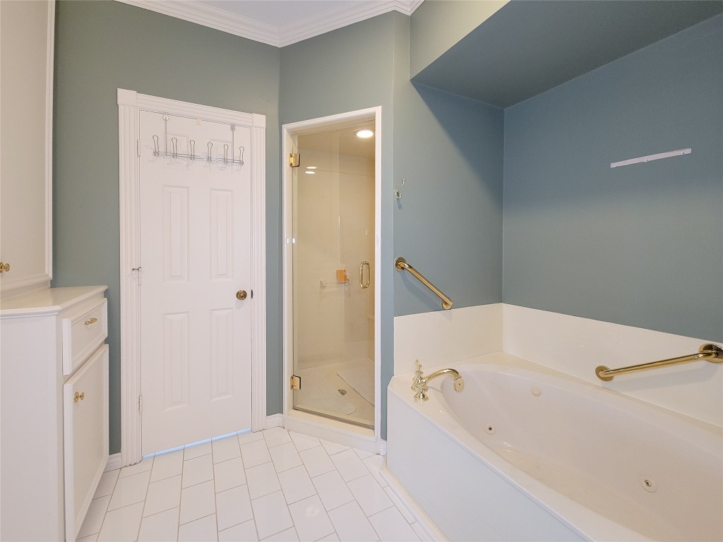 5810 Glenmere Lane Spring, TX 77379 - Photo 26 of 46 a bathroom with a bathtub and a shower