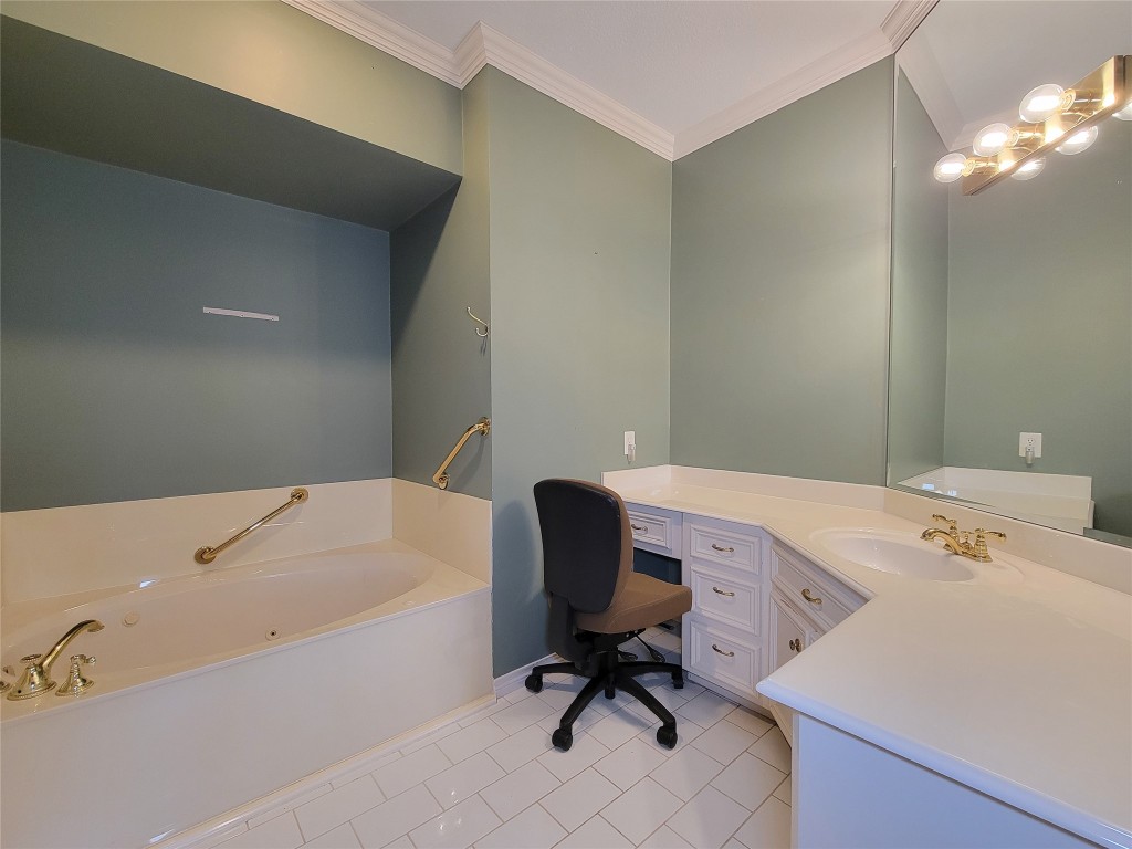 5810 Glenmere Lane Spring, TX 77379 - Photo 27 of 46 a bathroom with a tub and a chair