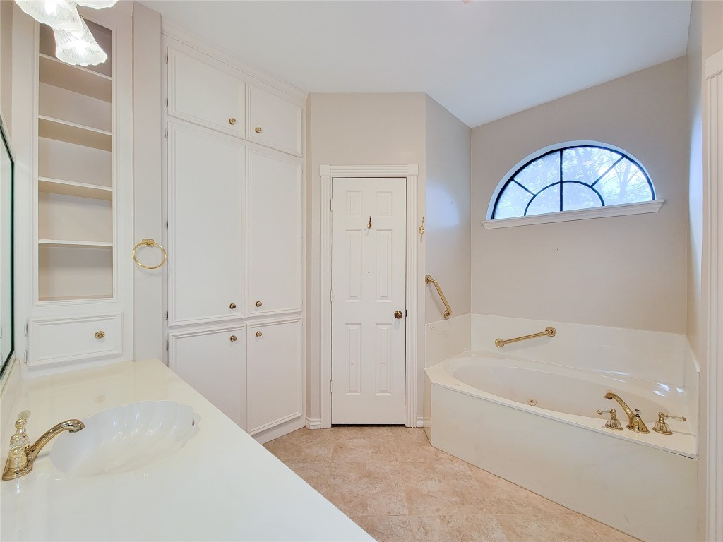 5810 Glenmere Lane Spring, TX 77379 - Photo 34 of 46 a bathroom with a bathtub and a shower