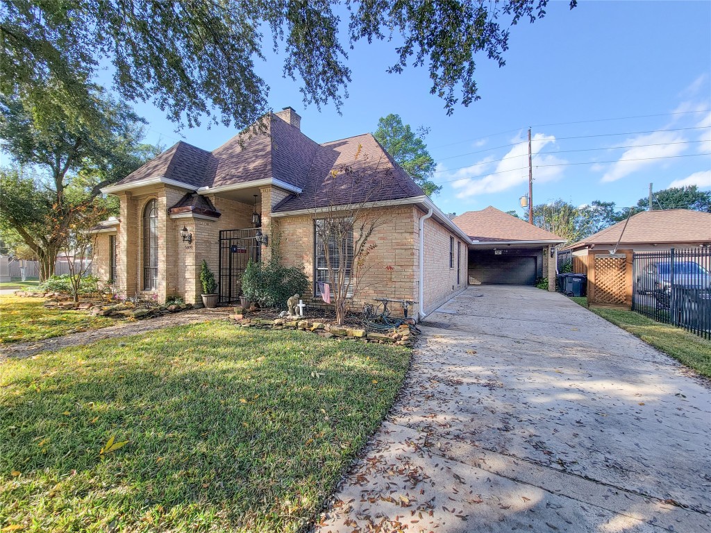 5810 Glenmere Lane Spring, TX 77379 - Photo 37 of 46 a front view of a house with garden