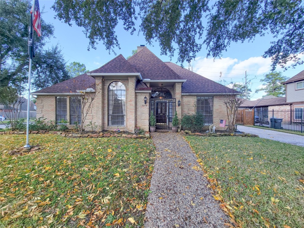 5810 Glenmere Lane Spring, TX 77379 - Photo 39 of 46 a front view of a house with garden
