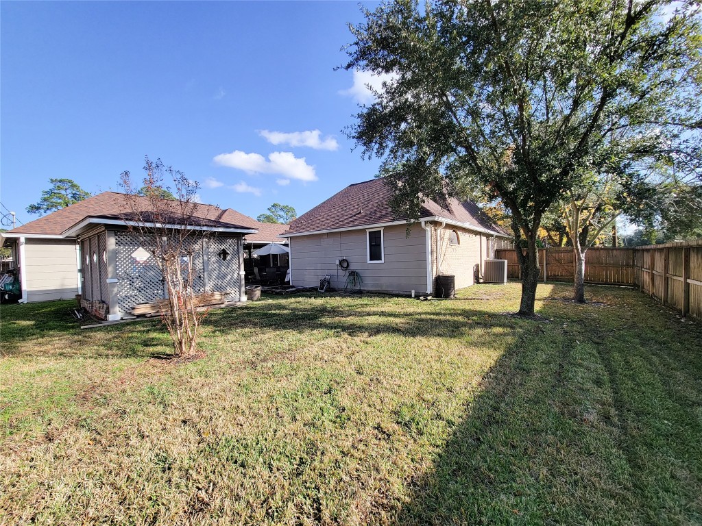 5810 Glenmere Lane Spring, TX 77379 - Photo 42 of 46 a view of a house with backyard and trees