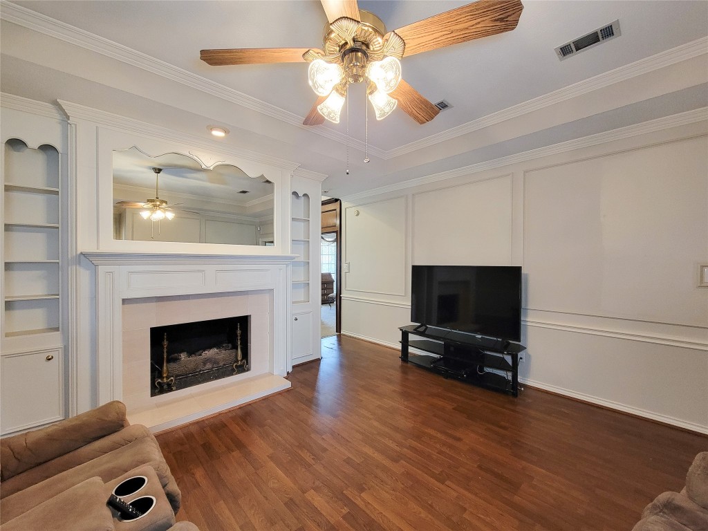 5810 Glenmere Lane Spring, TX 77379 - Photo 7 of 46 a living room with furniture fireplace and flat screen tv