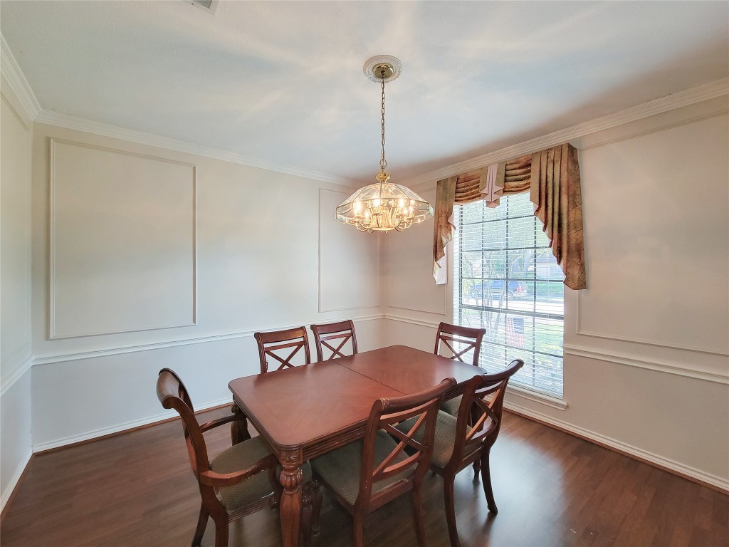 5810 Glenmere Lane Spring, TX 77379 - Photo 10 of 46 a view of a dining room with furniture window and wooden floor