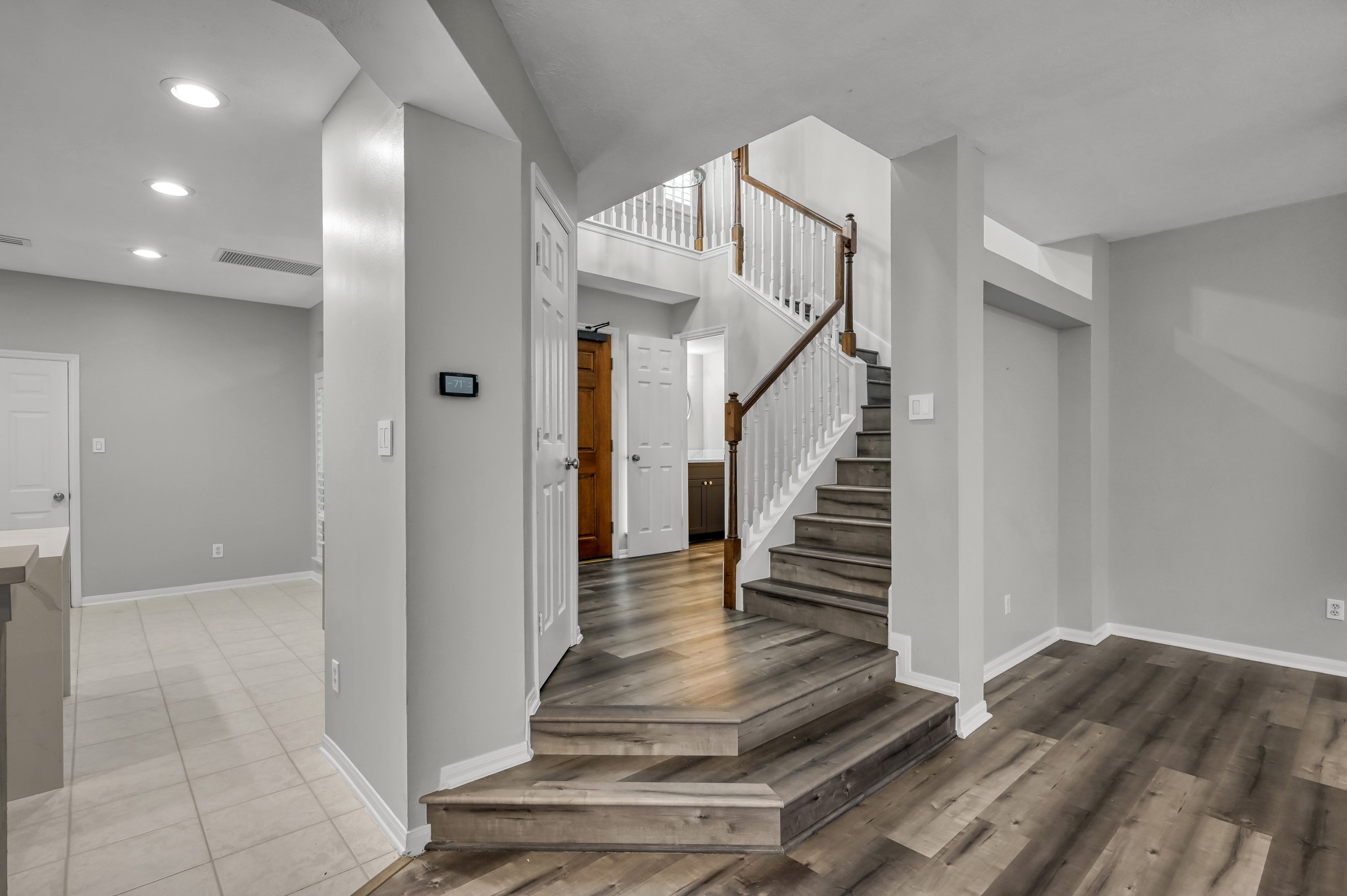 23 Alderon Woods Place Spring, TX 77382 - Photo 10 of 25 a view of entryway and hall with wooden floor