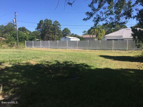 630 Weaver Road Southwest Palm Bay, FL 32908 - Photo 11 of 11 a view of a house with pool and a yard