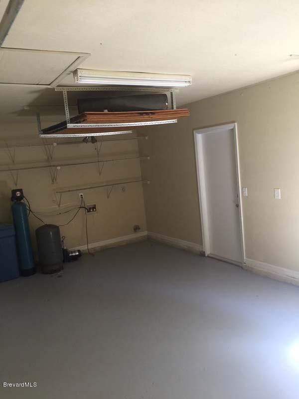 630 Weaver Road Southwest Palm Bay, FL 32908 - Photo 10 of 11 a view of room with racks on the wall