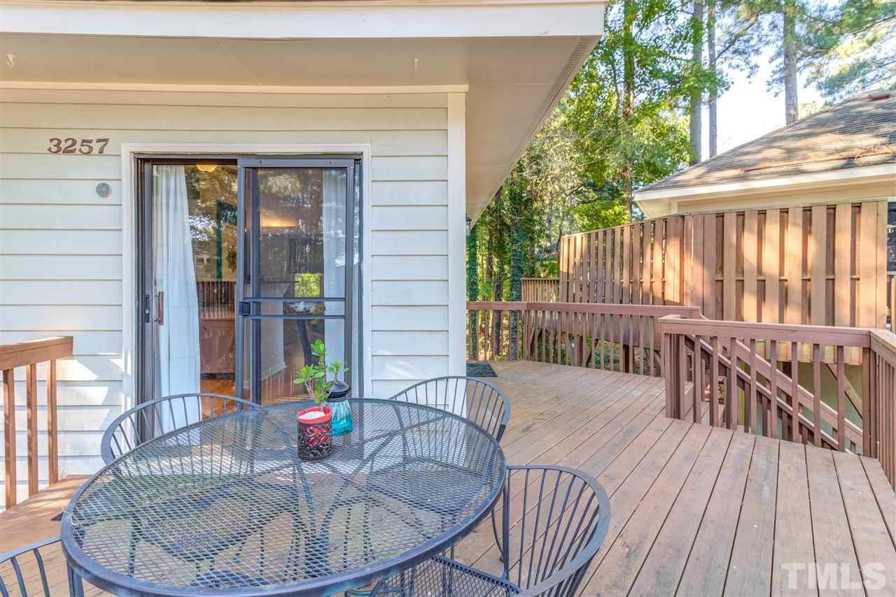 3257 Mill Run, Unit 3257 Raleigh, NC 27612 - Photo 3 of 24 a balcony with furniture and wooden floor