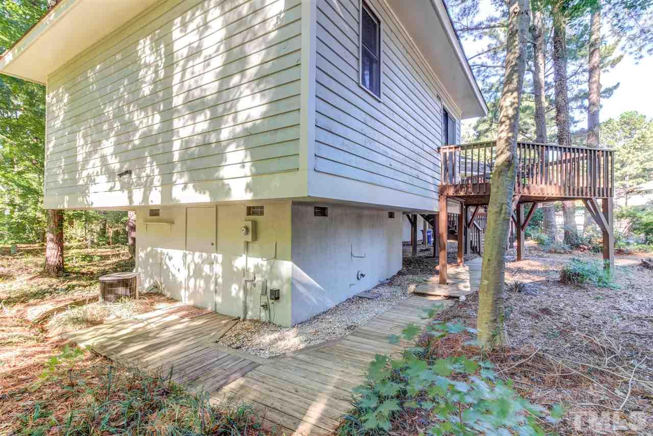 3257 Mill Run, Unit 3257 Raleigh, NC 27612 - Photo 22 of 24 a view of a house with a yard and sitting area