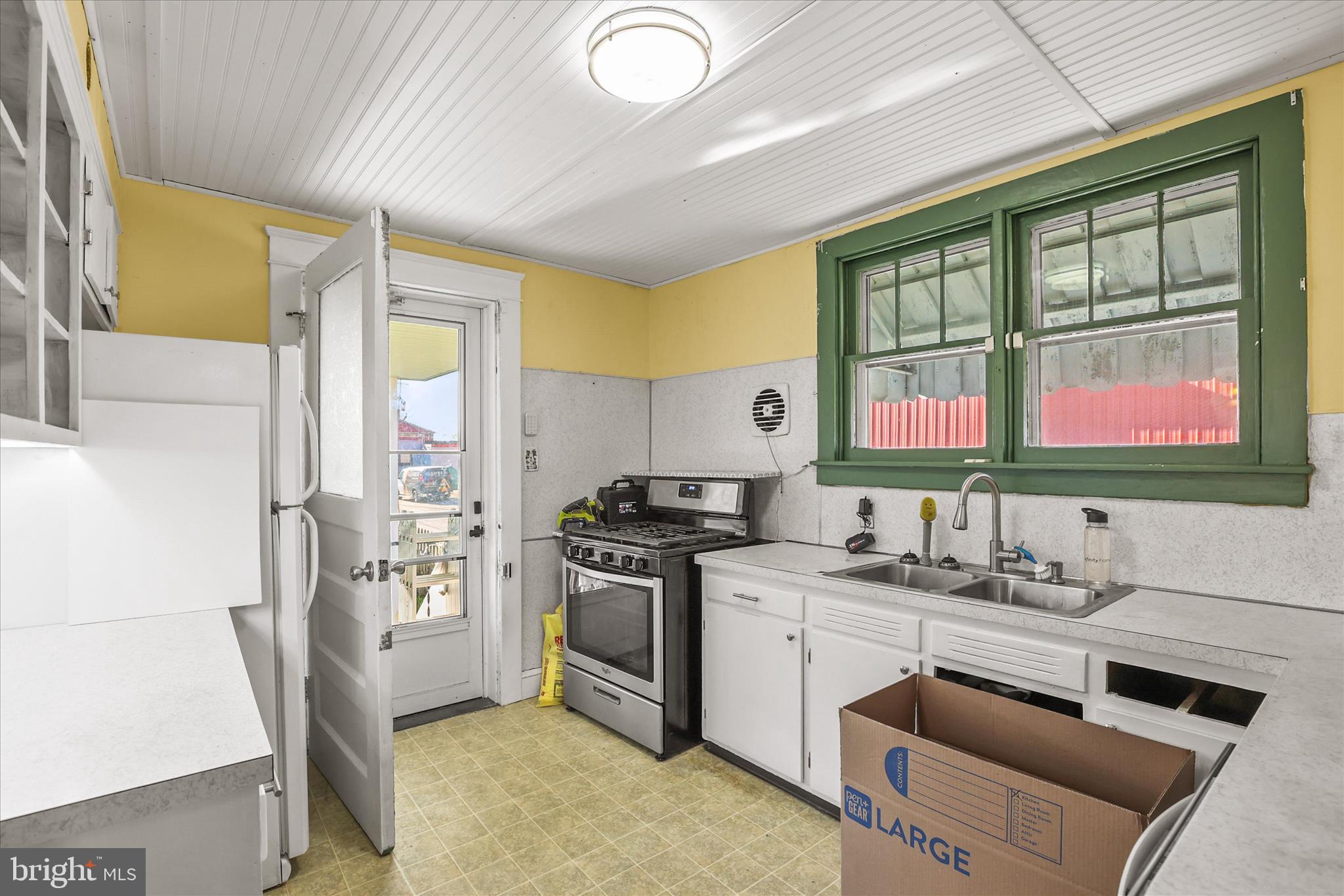 4 Penn Street Hanover, PA 17331 - Photo 7 of 28 a kitchen with stainless steel appliances granite countertop a sink stove and refrigerator