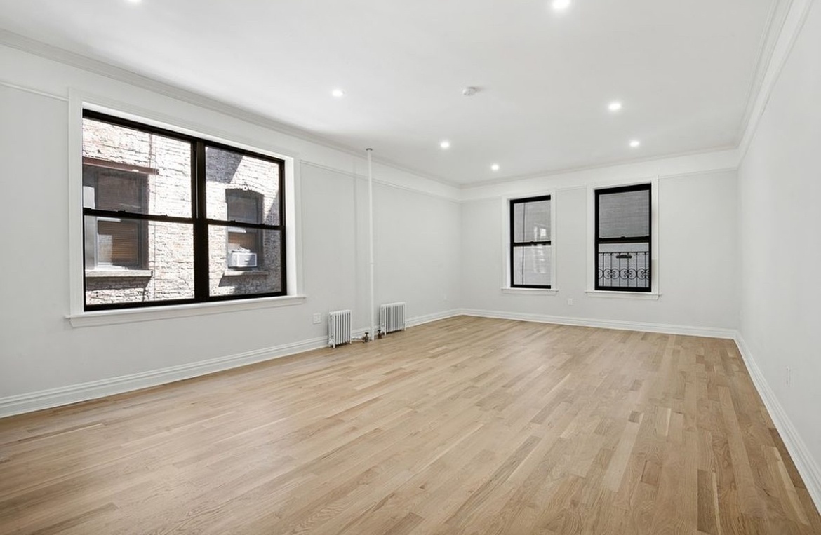 575 Riverside Drive, Unit 42 Manhattan, NY 10031 - Photo 3 of 12 a view of empty room with windows