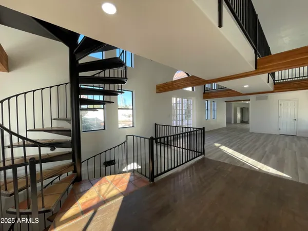 a view of an empty room and fire place