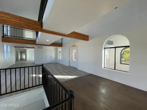 a view of hallway with wooden floor