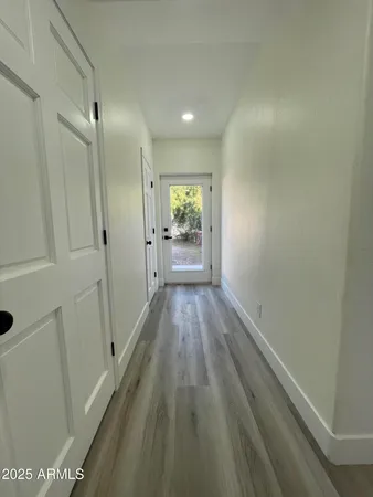 a view of a livingroom with furniture and wooden floor
