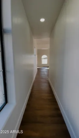 a view of a balcony with wooden floor and fence