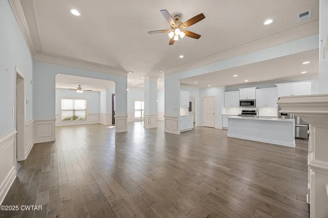 a view of kitchen with cabinets and wooden floor