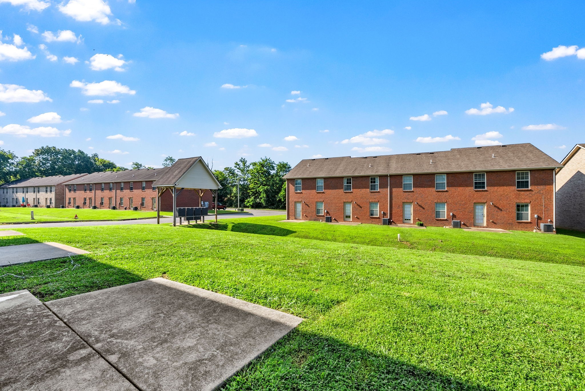 770 Needmore Road, Unit 18 Clarksville, TN 37040 - Photo 18 of 20 a view of a big yard in front of a house with a yard