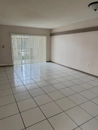 a view of a livingroom and window
