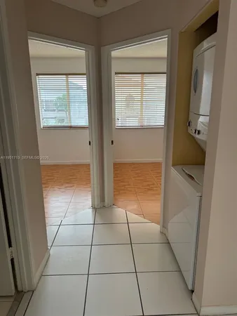 a view of an empty room with a bathroom