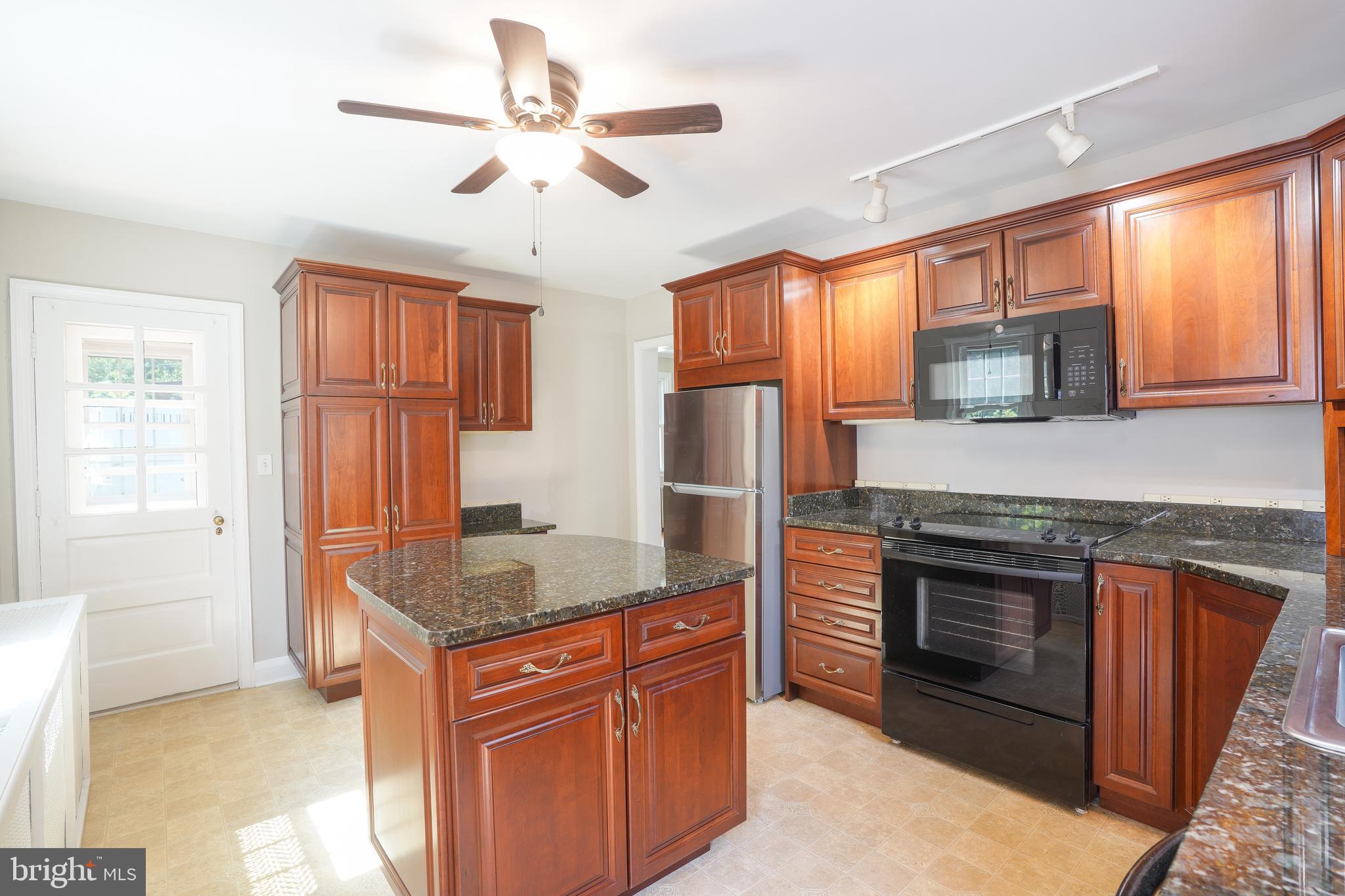 616 Warwick Road Baltimore, MD 21229 - Photo 14 of 32 Tons of storage in pretty wood cabinets