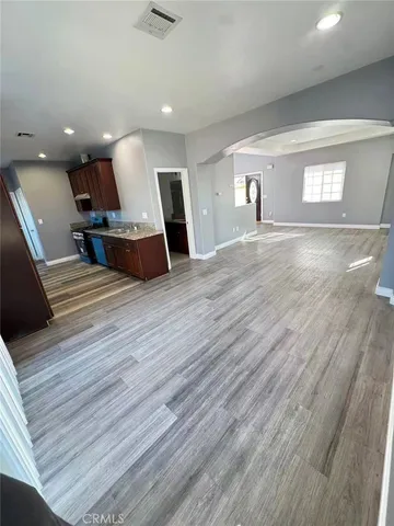 a view of outdoor space with wooden floor and windows