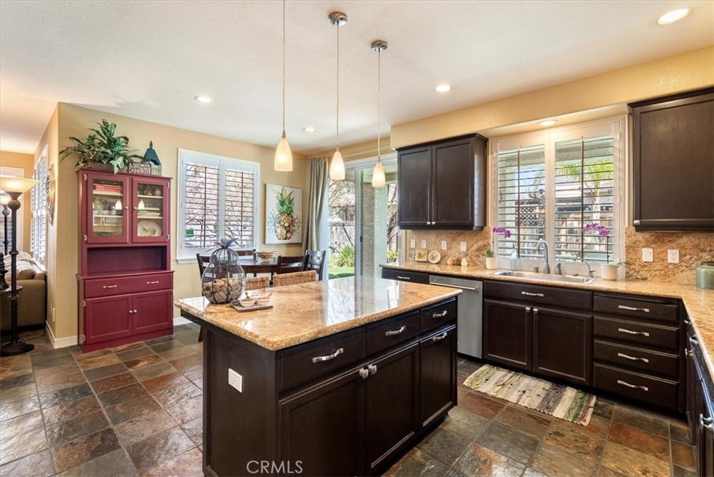 1945 Fieldstone Circle Paso Robles, CA 93446 - Photo 12 of 48 a kitchen with a sink stove and refrigerator
