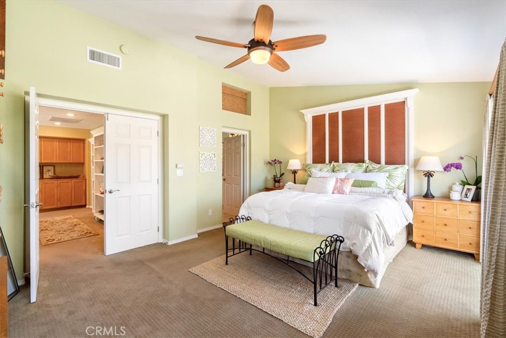 1945 Fieldstone Circle Paso Robles, CA 93446 - Photo 21 of 48 a spacious bedroom with a bed and a chandelier fan