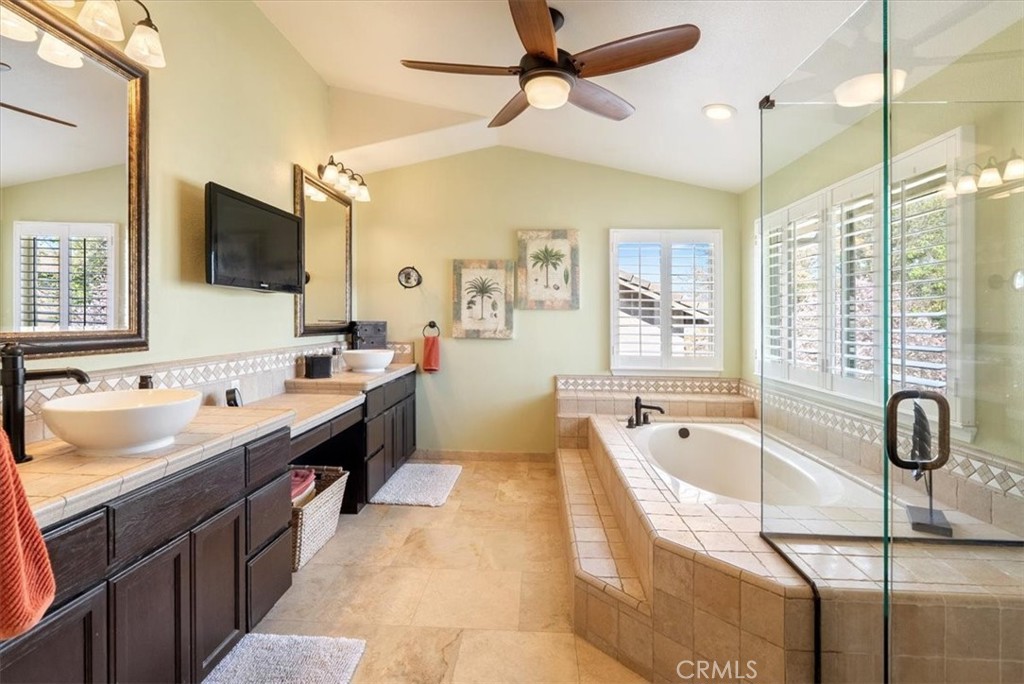 1945 Fieldstone Circle Paso Robles, CA 93446 - Photo 22 of 48 a spacious bathroom with a tub sink and mirror