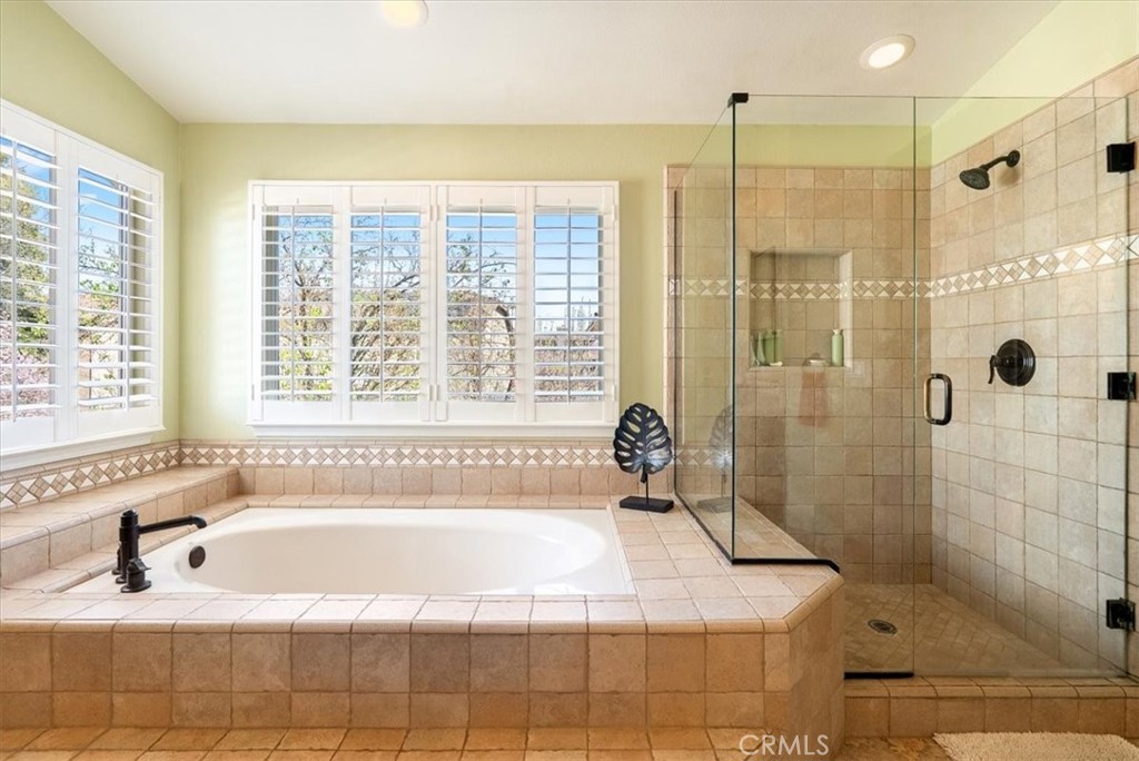 1945 Fieldstone Circle Paso Robles, CA 93446 - Photo 24 of 48 a bathroom with a bathtub and shower