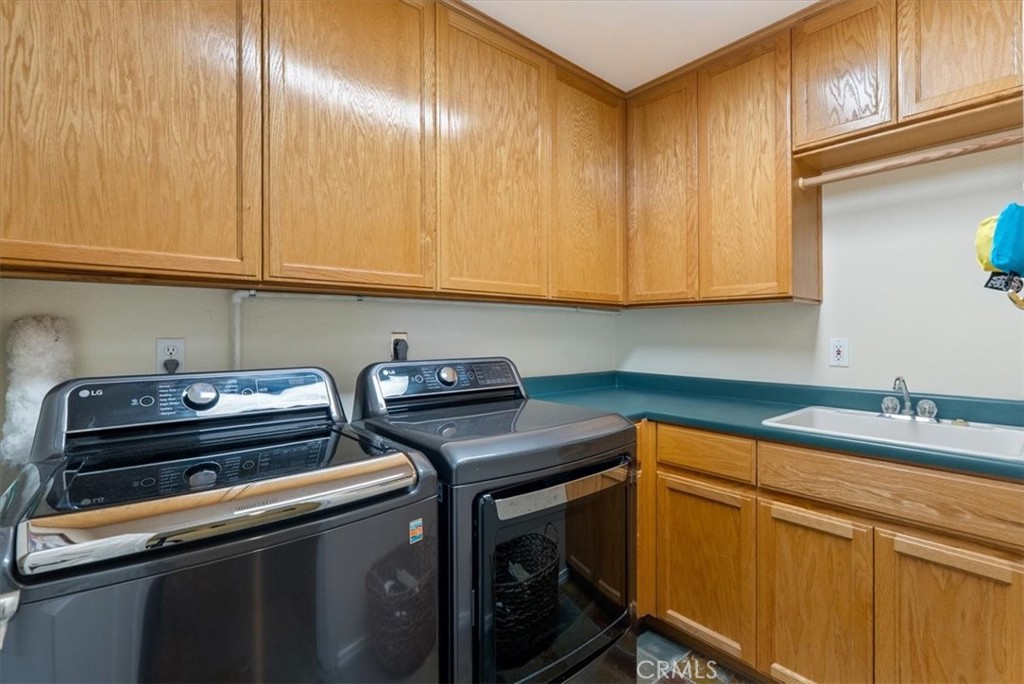 1945 Fieldstone Circle Paso Robles, CA 93446 - Photo 30 of 48 a kitchen with a sink cabinets and stainless steel appliances