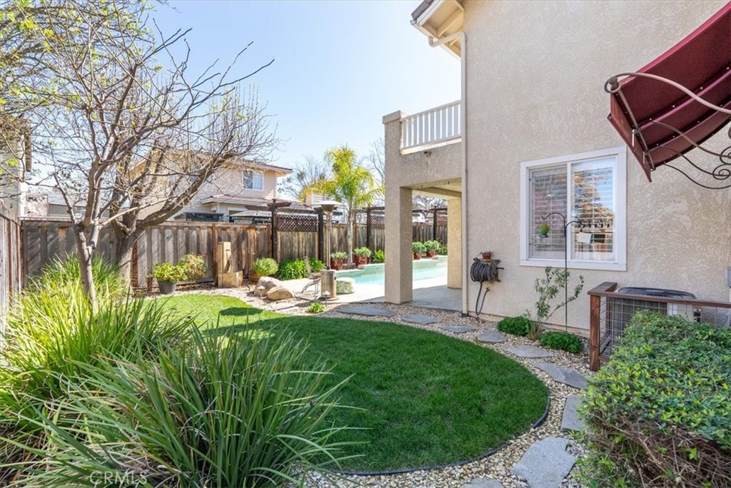 1945 Fieldstone Circle Paso Robles, CA 93446 - Photo 33 of 48 a view of a house with a backyard porch and sitting area