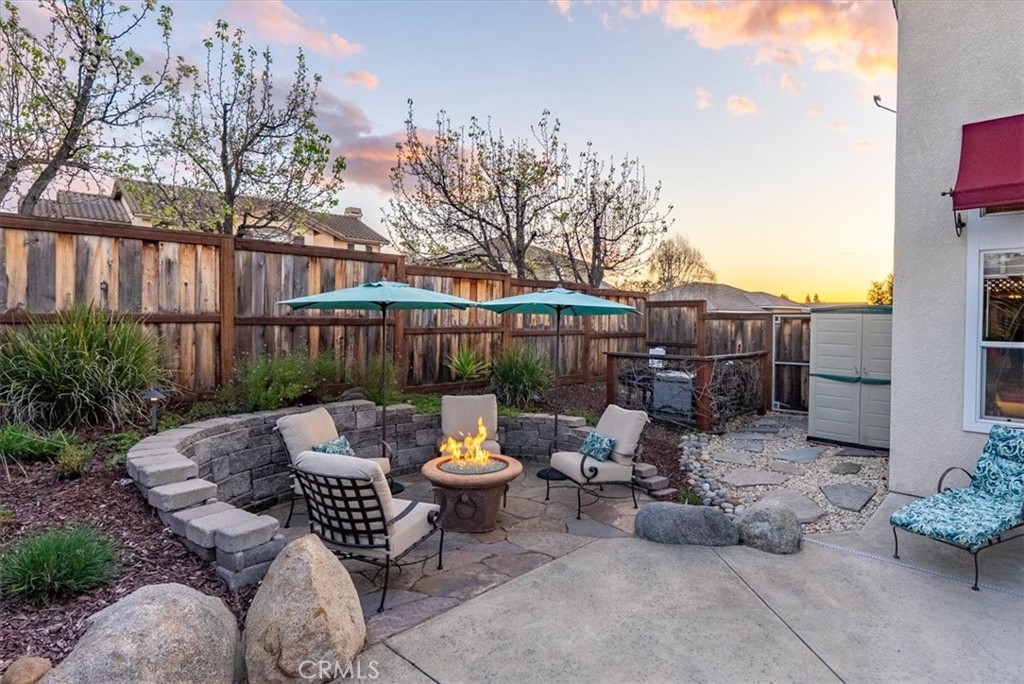 1945 Fieldstone Circle Paso Robles, CA 93446 - Photo 36 of 48 a view of a patio with furniture and iron fence