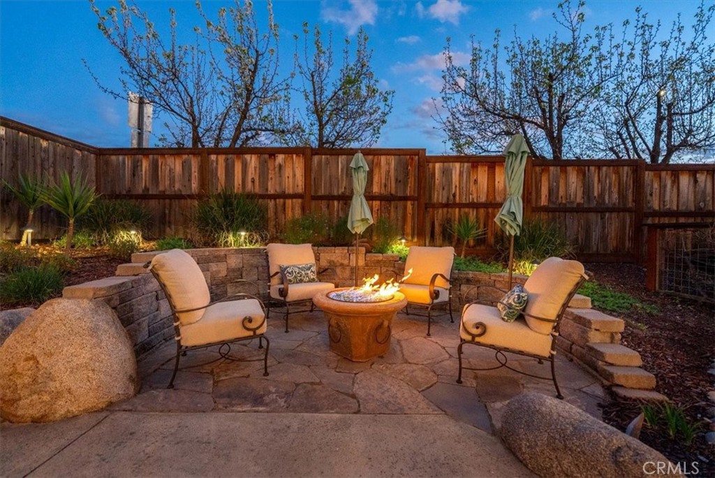 1945 Fieldstone Circle Paso Robles, CA 93446 - Photo 40 of 48 a backyard of a house with fountain table and chairs