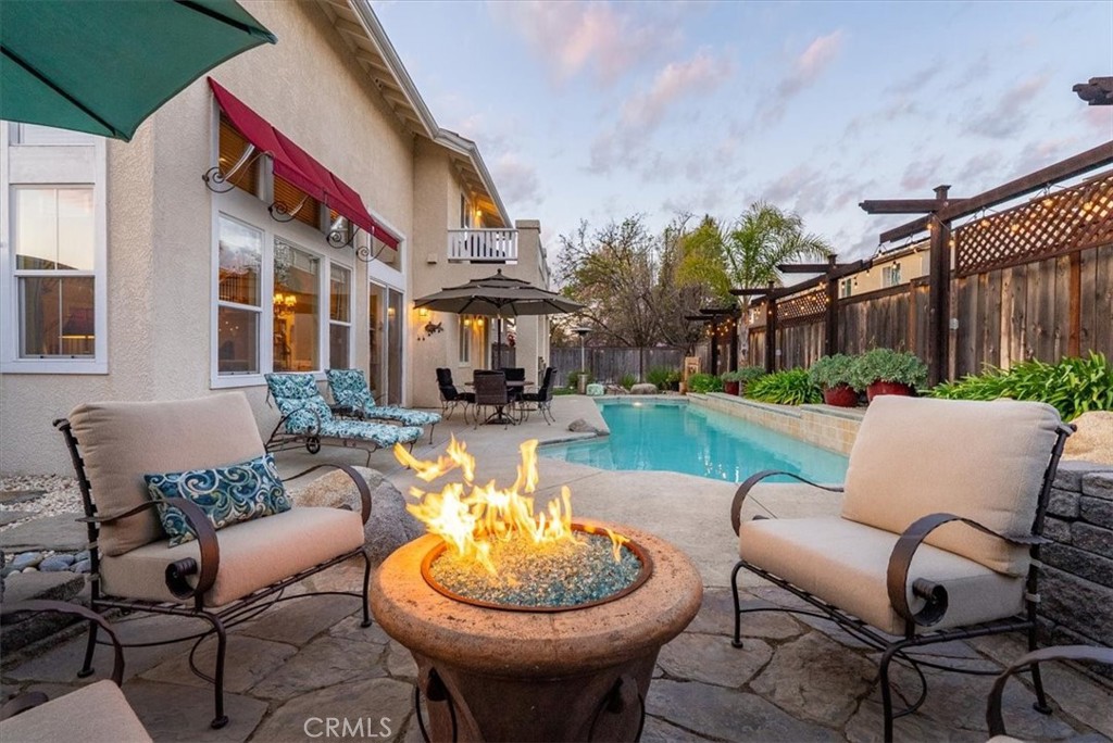 1945 Fieldstone Circle Paso Robles, CA 93446 - Photo 41 of 48 a view of a patio with couches table and chairs and potted plants