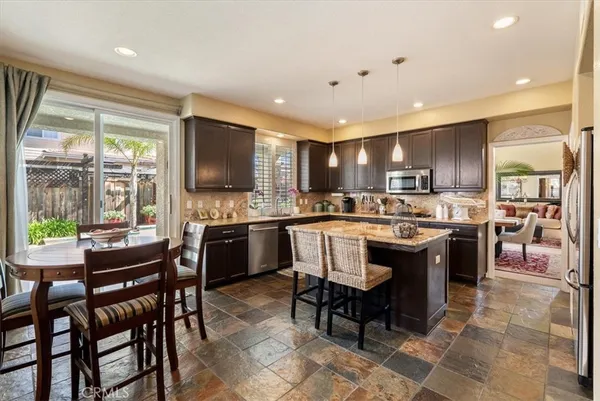 a kitchen with a sink stove and refrigerator