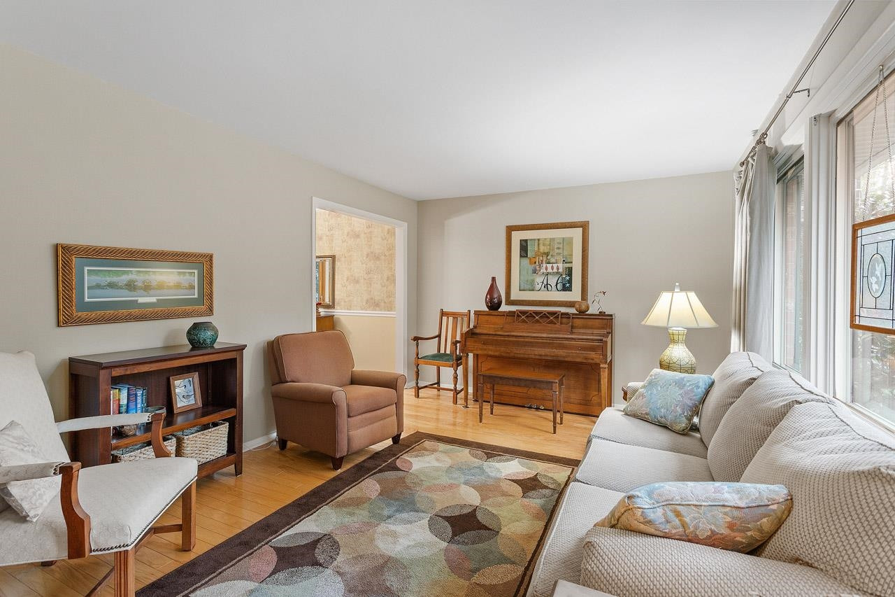 809 Silver Leaf Place Raleigh, NC 27609 - Photo 10 of 34 a living room with furniture and a flat screen tv