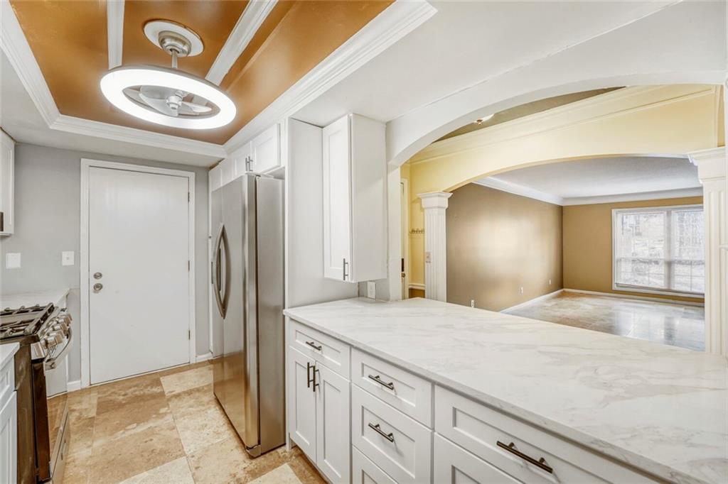 6851 Roswell Road, Unit M13 Atlanta, GA 30328 - Photo 11 of 28 a bathroom with a granite countertop sink and a mirror