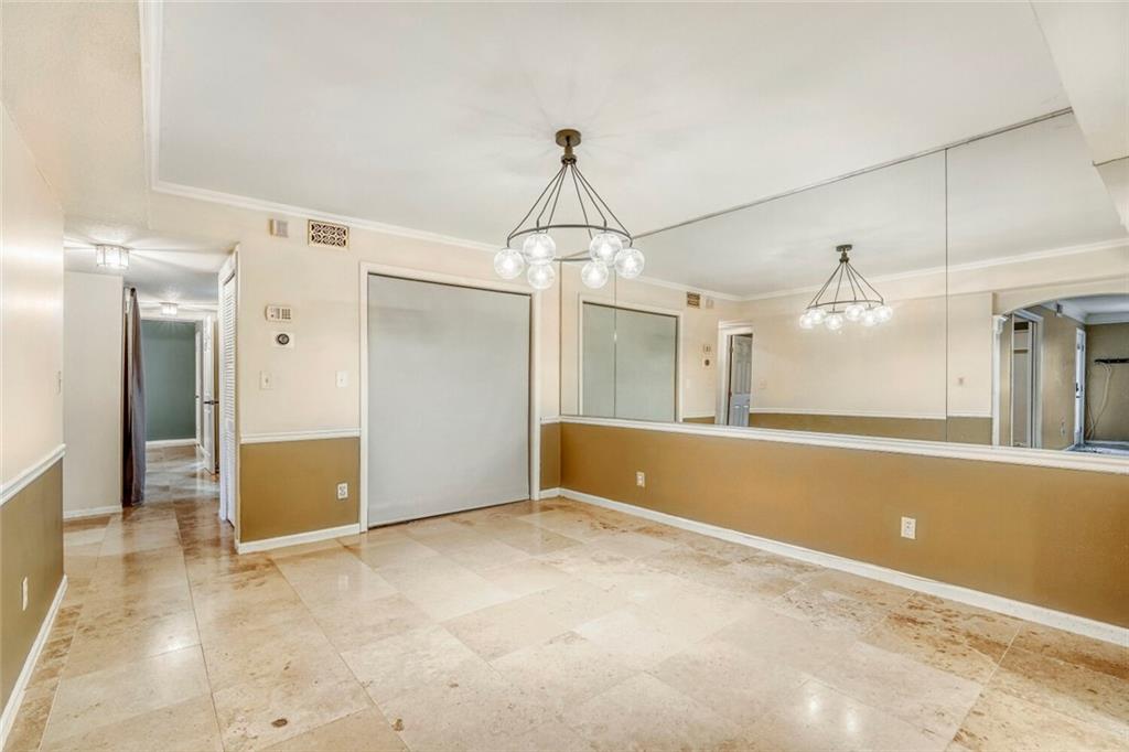 6851 Roswell Road, Unit M13 Atlanta, GA 30328 - Photo 15 of 28 a view of a room with window and chandelier
